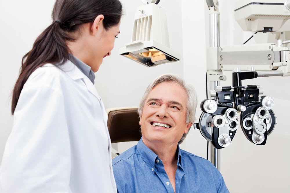 Smiling patient about to have an eye exam