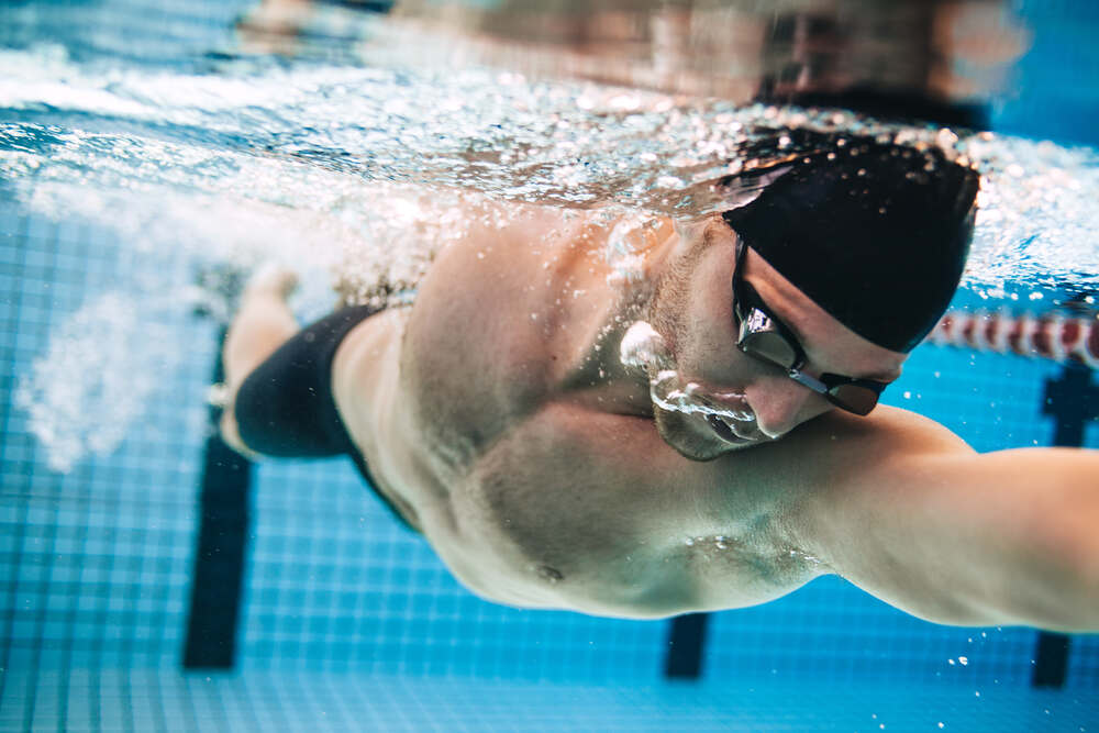 young man swimming in the pool