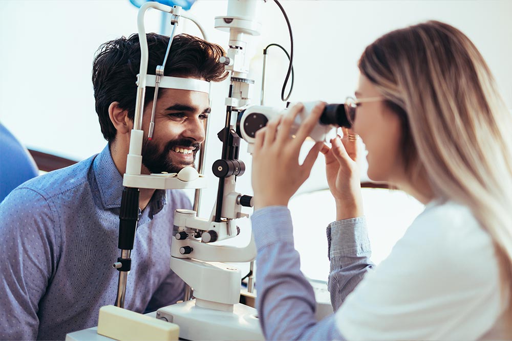 Man having his eyes examined by doctor