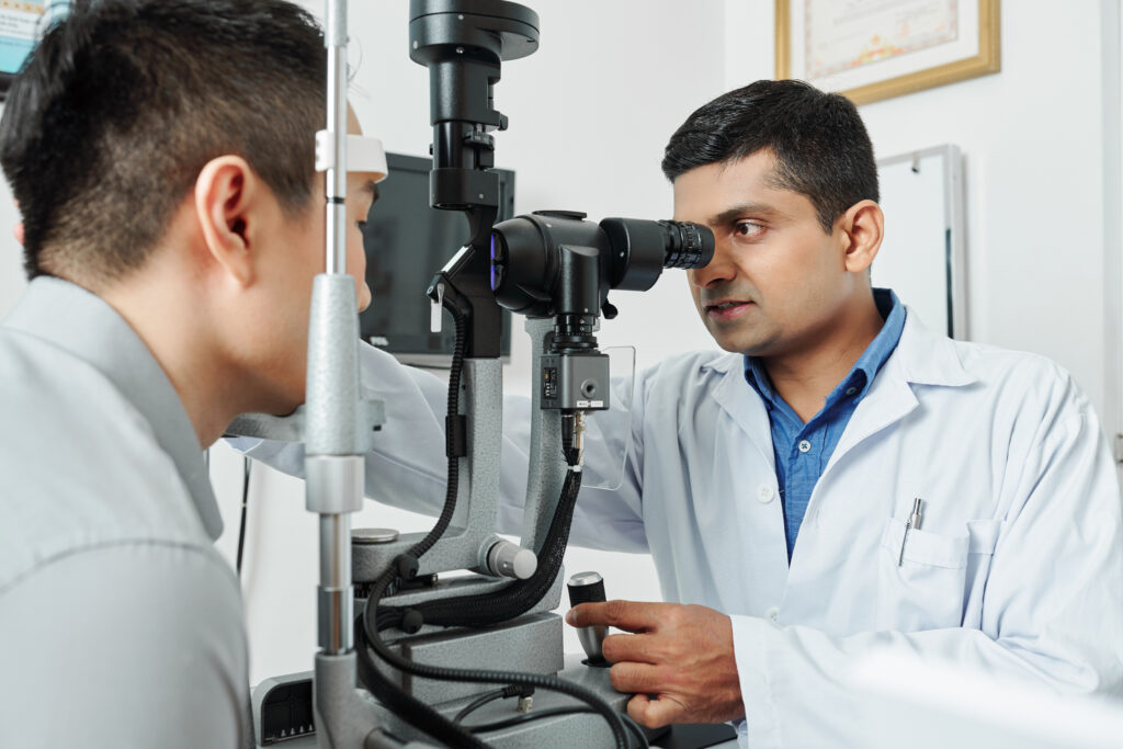 Optometrist examining a patient