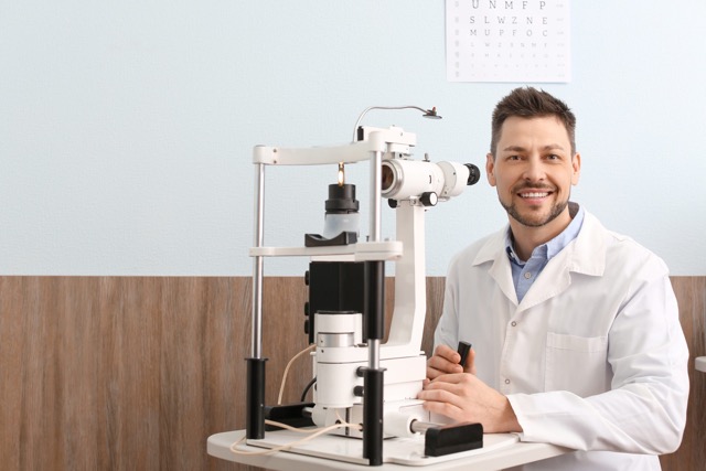 Male ophthalmologist in his office