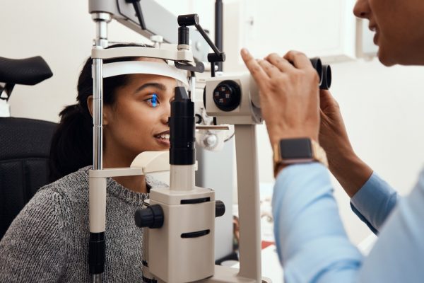 Woman getting her eyes checked by an eye doctor