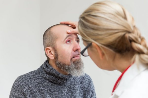 female doctor is doing a examination of an eye with stye