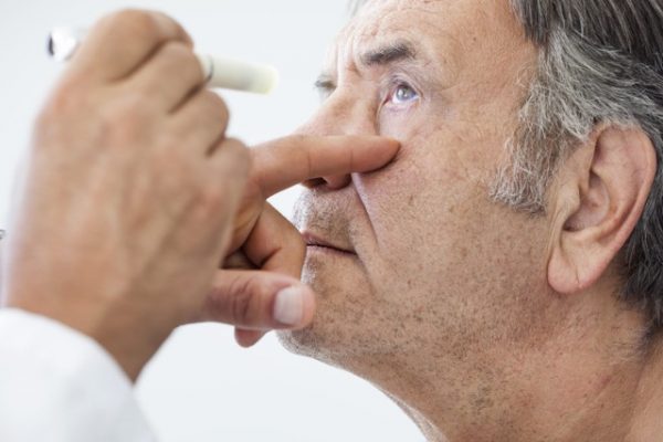 Elderly man examined by an Ophthalmologist